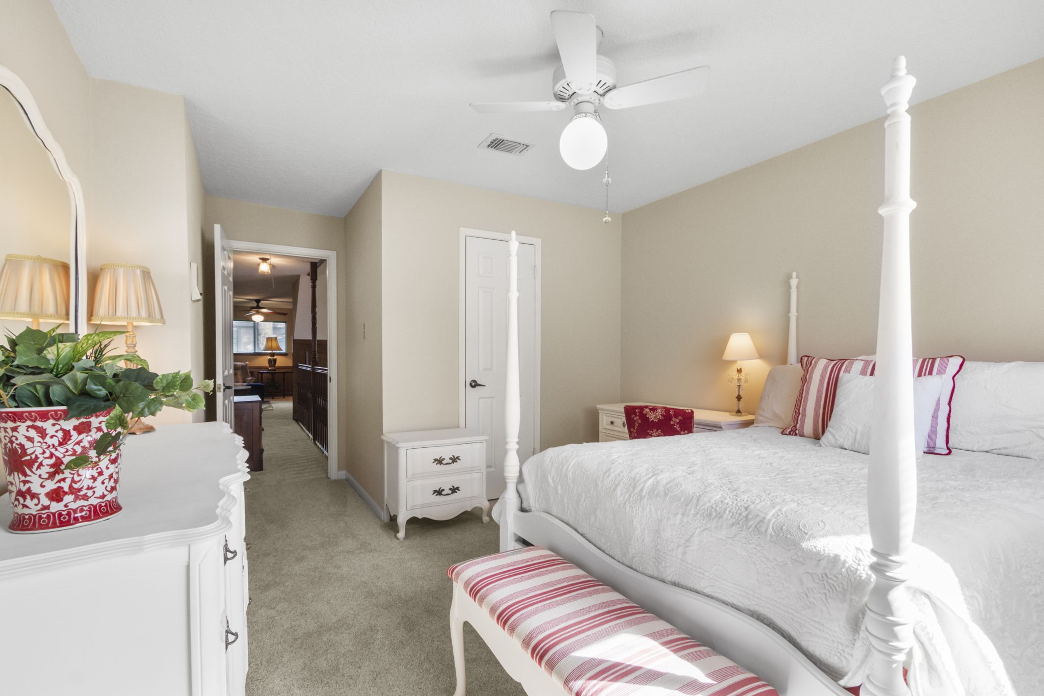 17710 Treeloch Lane Spring, TX 77379 - Photo 37 of 45 a bedroom with a bed and a chandelier