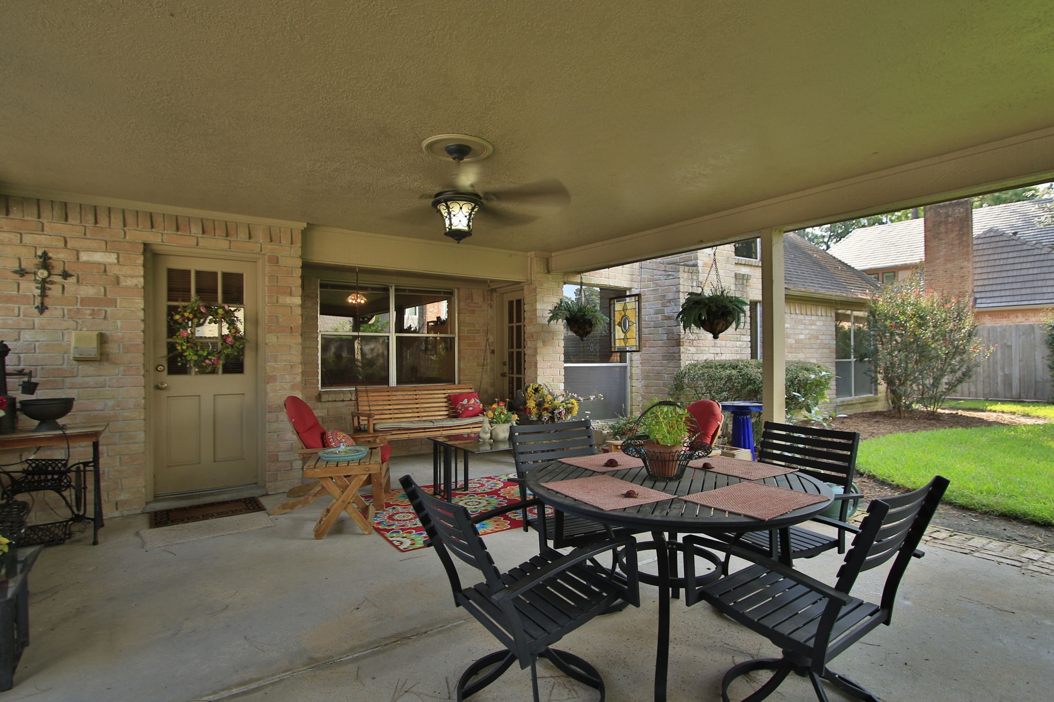 17710 Treeloch Lane Spring, TX 77379 - Photo 38 of 45 a view of a patio with a dining table and chairs