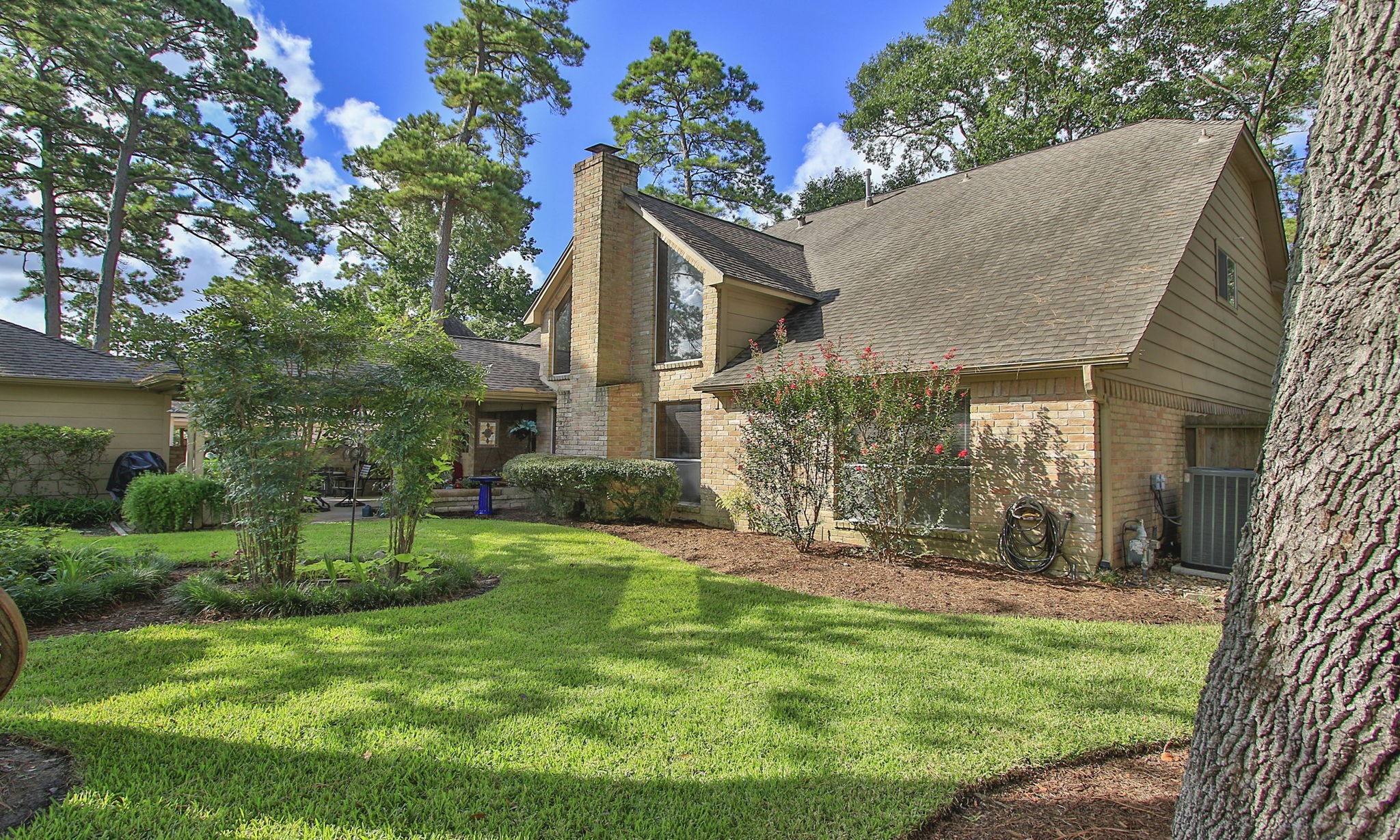 17710 Treeloch Lane Spring, TX 77379 - Photo 42 of 45 a view of a house with a yard and sitting area