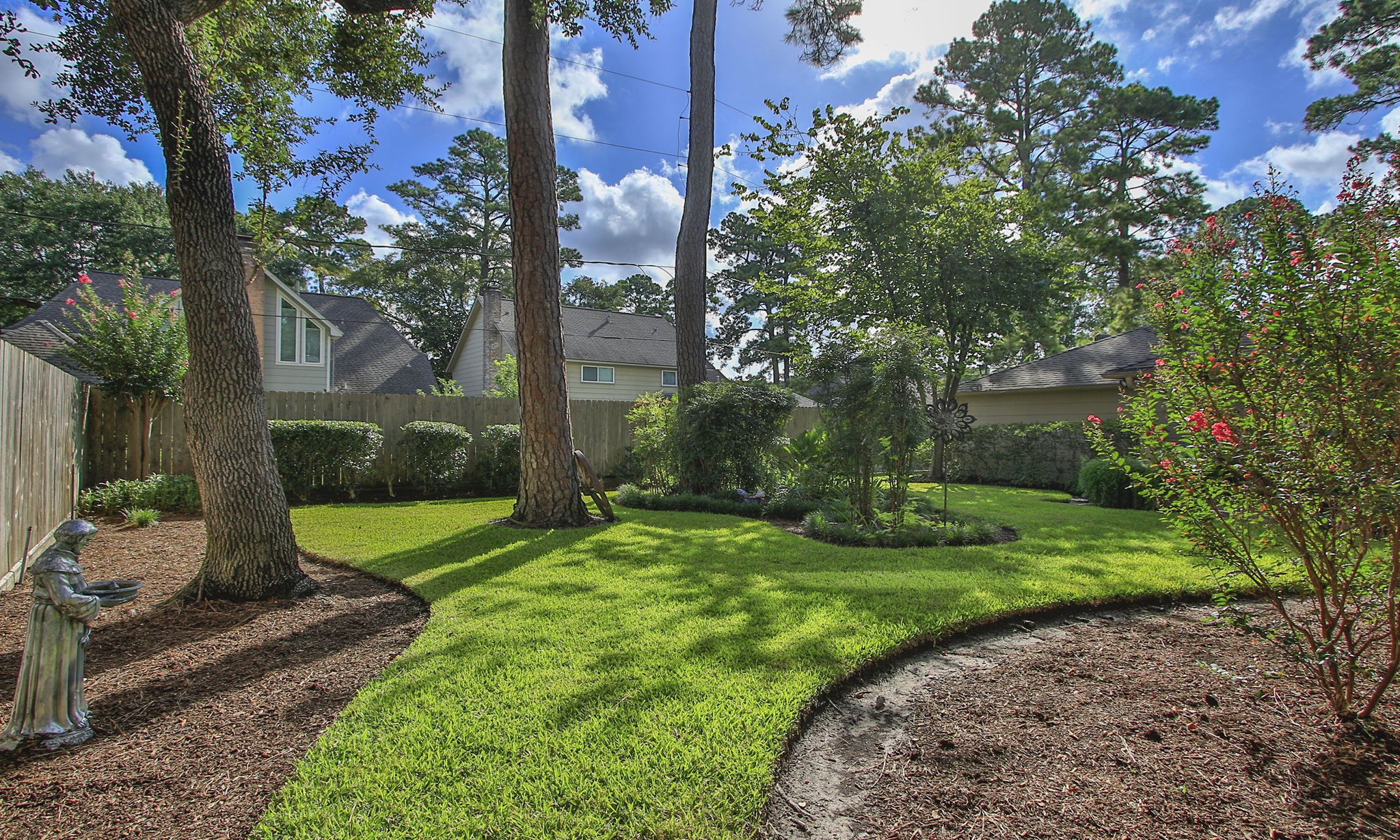 17710 Treeloch Lane Spring, TX 77379 - Photo 44 of 45 a view of a garden with a fountain