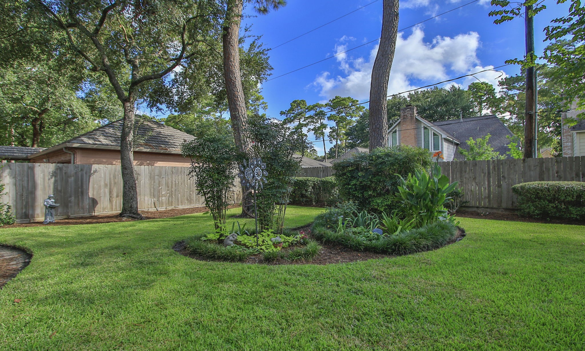 17710 Treeloch Lane Spring, TX 77379 - Photo 45 of 45 a view of a garden with a fountain