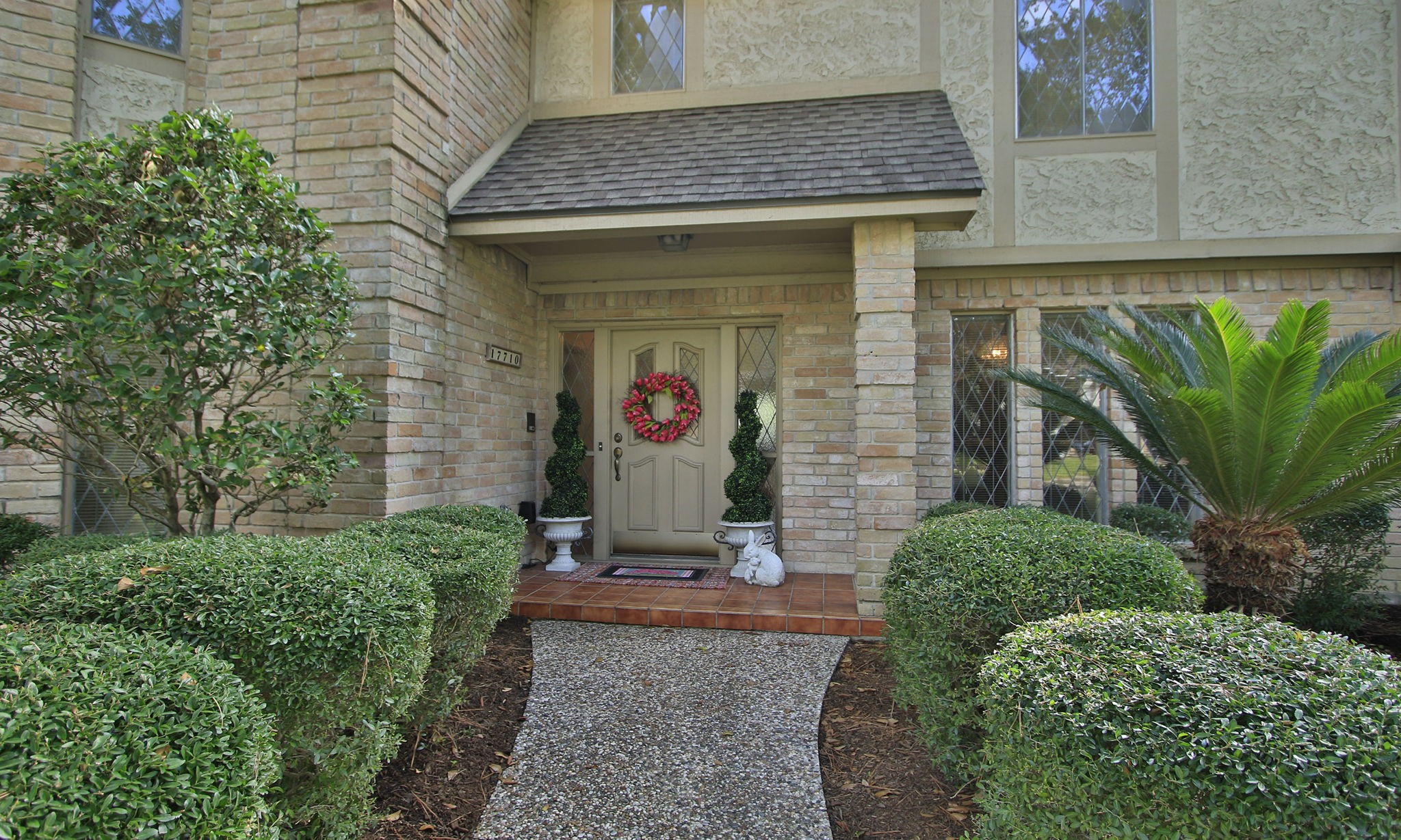 17710 Treeloch Lane Spring, TX 77379 - Photo 9 of 45 a front view of a house with garden