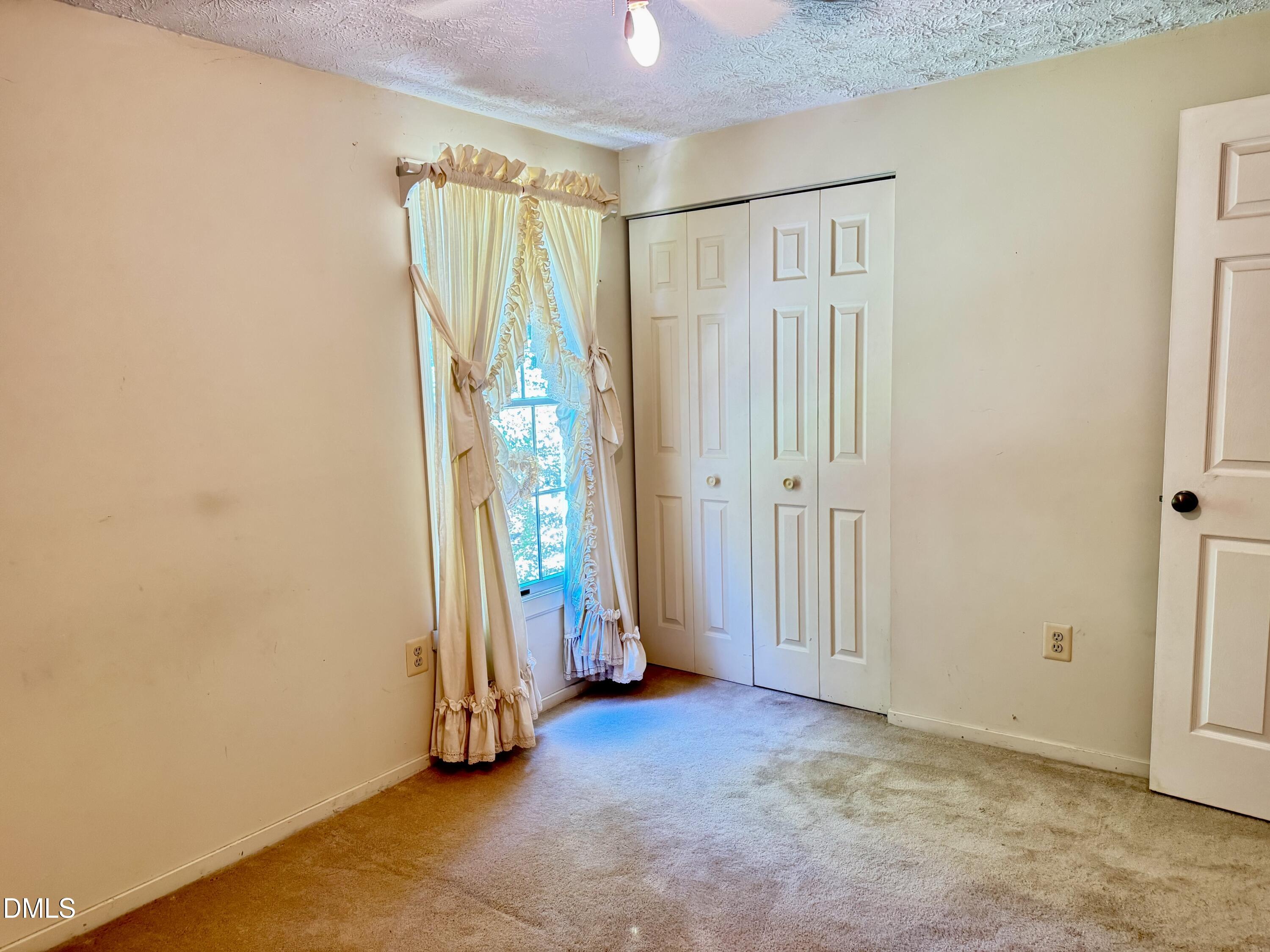 84 Wintergreen Road Henderson, NC 27537 - Photo 32 of 49 an empty room with windows