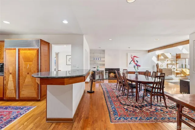 a large kitchen with stainless steel appliances granite countertop a refrigerator and a stove