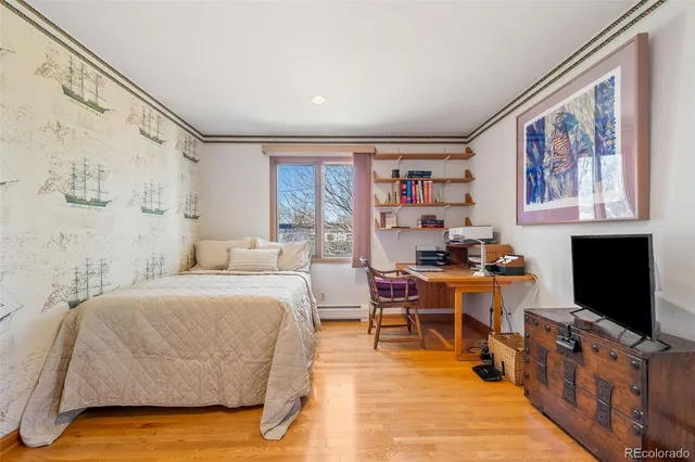 a bathroom with a granite countertop sink a mirror a bathtub and shower