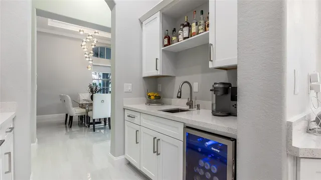 a kitchen with stainless steel appliances granite countertop a sink dishwasher and cabinets with wooden floor