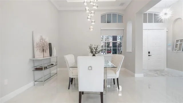 a dining room with furniture and window