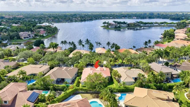 an aerial view of lake residential house with outdoor space and seating