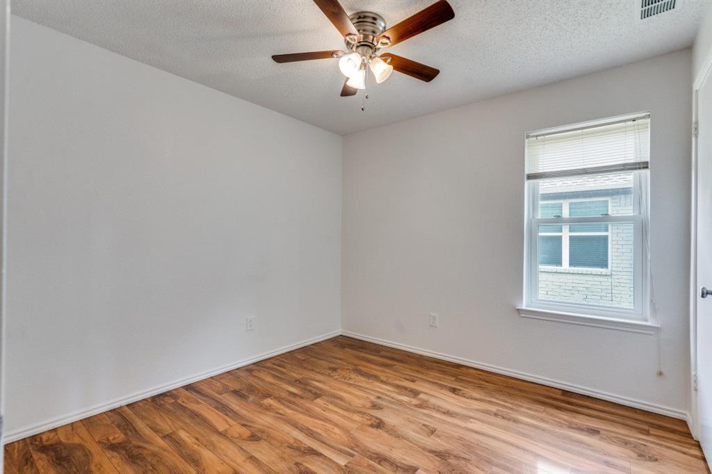 1509 Clover Drive Allen, TX 75002 - Photo 22 of 25 an empty room with windows and fan