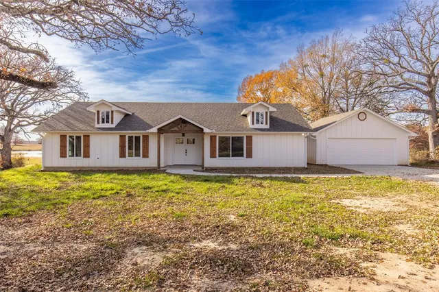 a front of a house with a yard