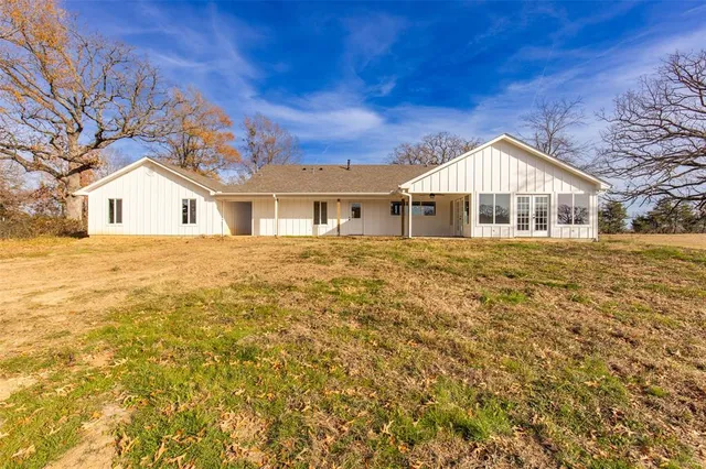 a view of an entryway with wooden floor and windows