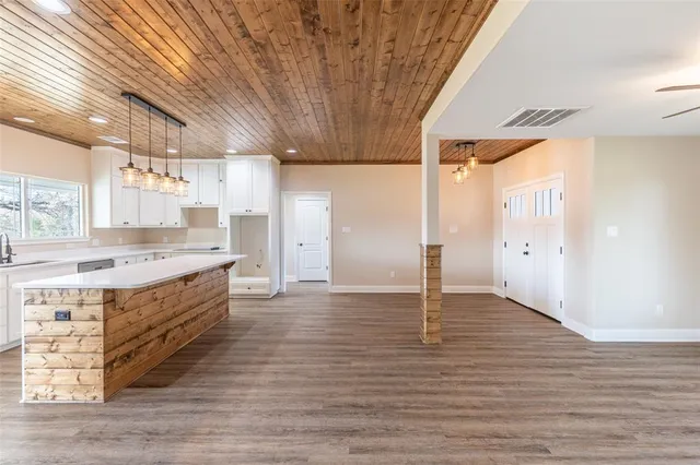 a spacious bathroom with double vanity and a bathtub