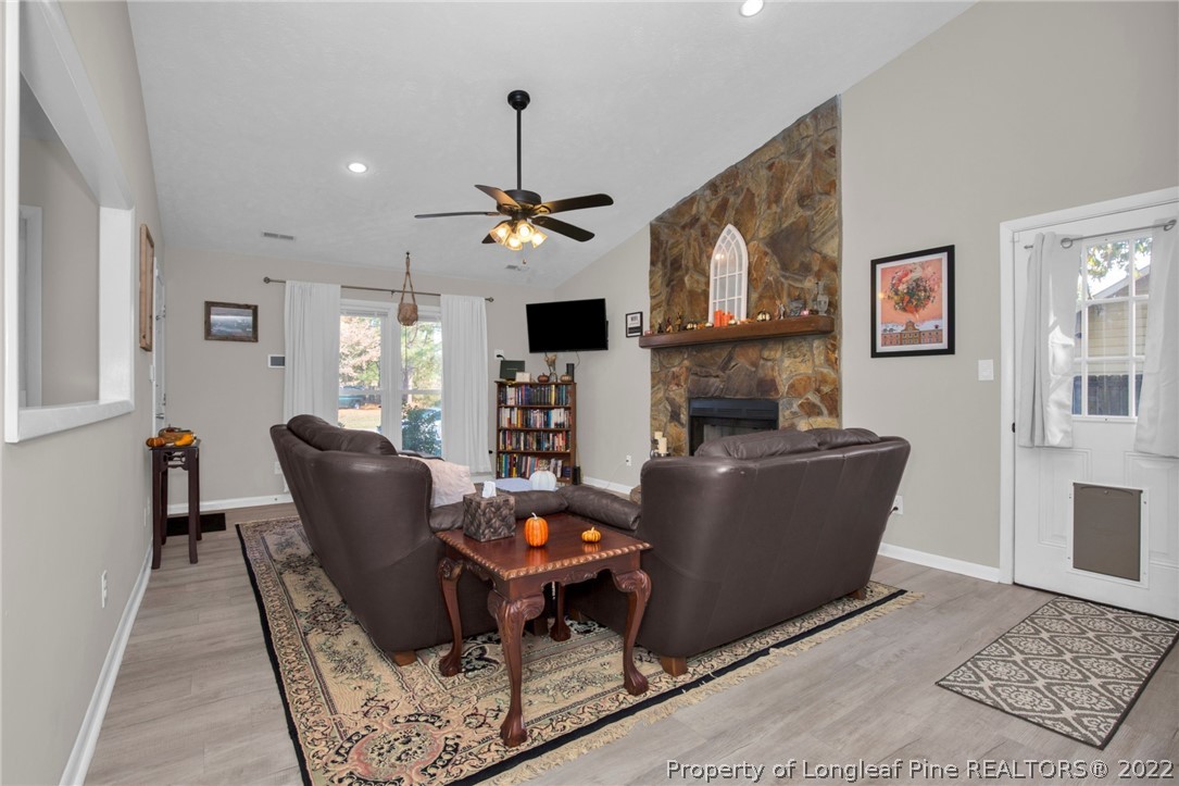 930 Rim Road Fayetteville, NC 28314 - Photo 7 of 30 a living room with furniture and a chandelier