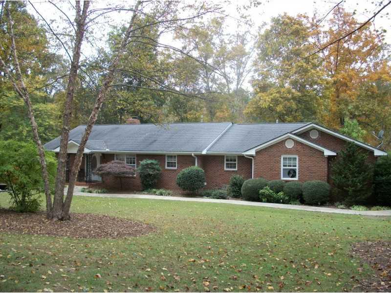 868 Poplar Springs Road Dallas, GA 30157 - Photo 1 of 1 Exterior Front. Brick Ranch on 3.78 Wooded Acres