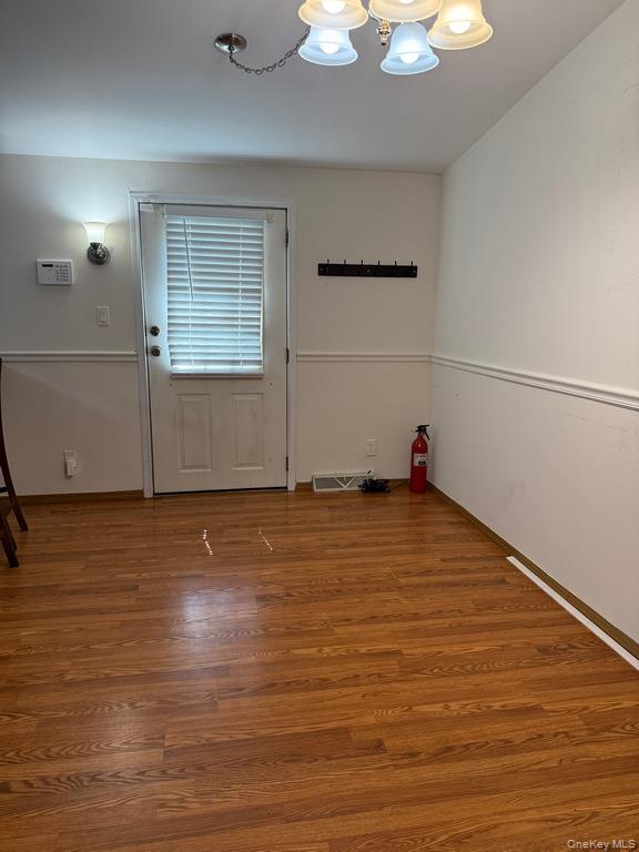 551 5th Avenue Middletown, NY 10941 - Photo 5 of 25 Entryway featuring a chandelier and wood finished floors