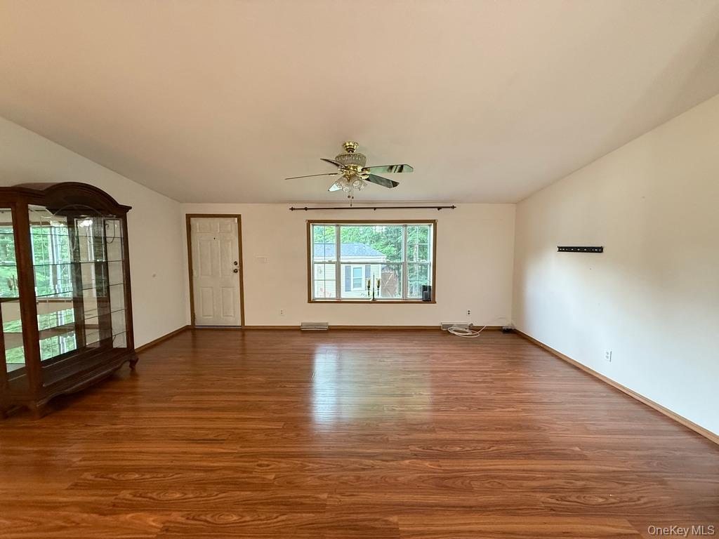 551 5th Avenue Middletown, NY 10941 - Photo 7 of 25 Spare room with wood finished floors, a ceiling fan, and lofted ceiling