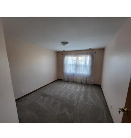a black and white photo of a living room