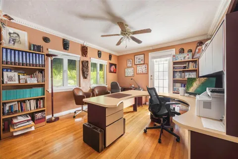a workspace with furniture window and wooden floor