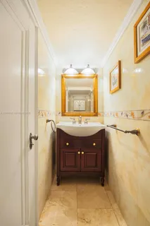 a bathroom with a sink a mirror and a bathtub