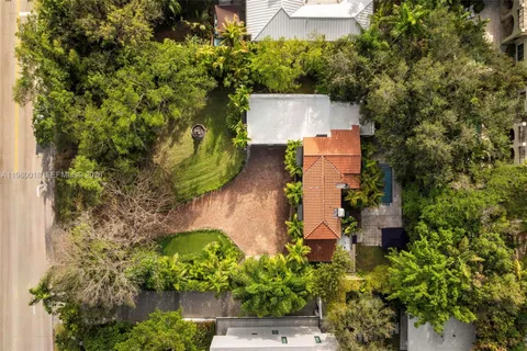 an aerial view of a house with a yard and a garden