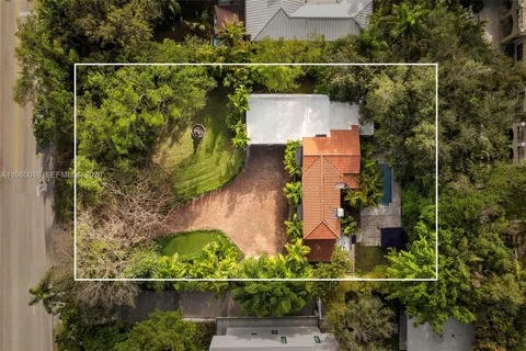 an aerial view of house with a swimming pool
