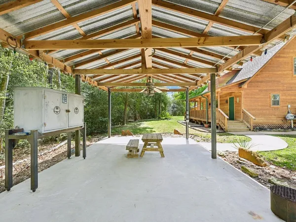 a view of a chairs and table in the patio