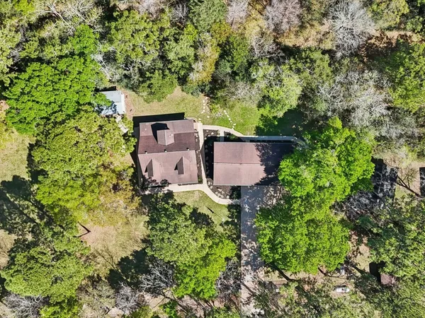 an aerial view of a house with yard and outdoor space