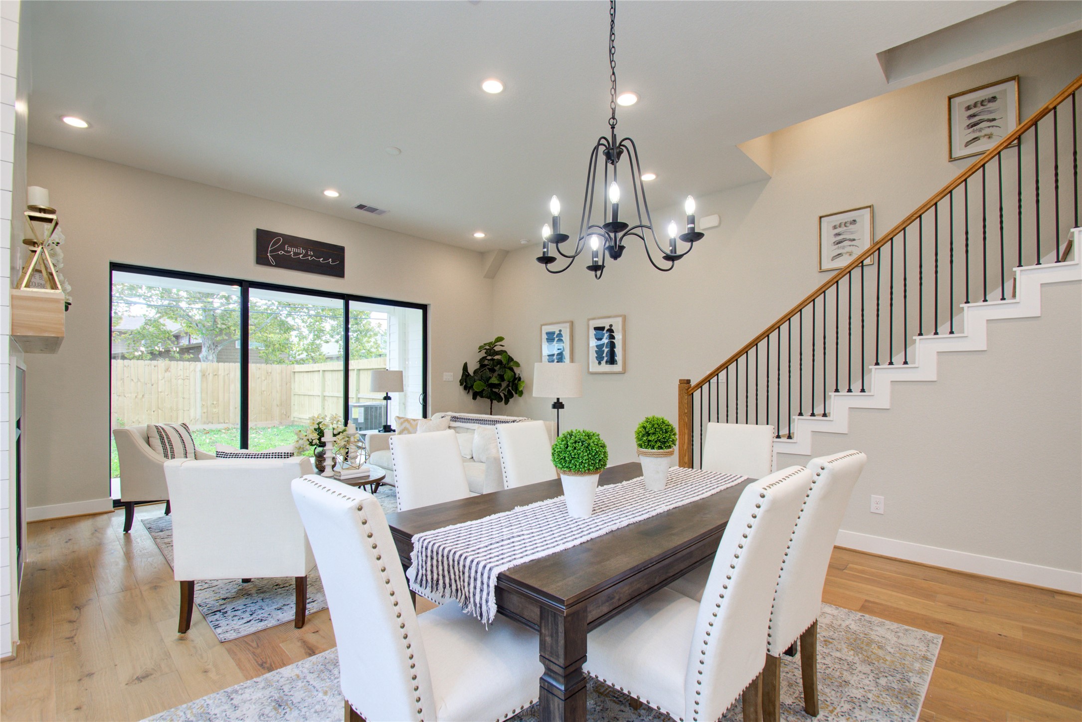 110 East 28th Street Houston, TX 77008 - Photo 20 of 43 a view of a dining room with furniture a chandelier and wooden floor