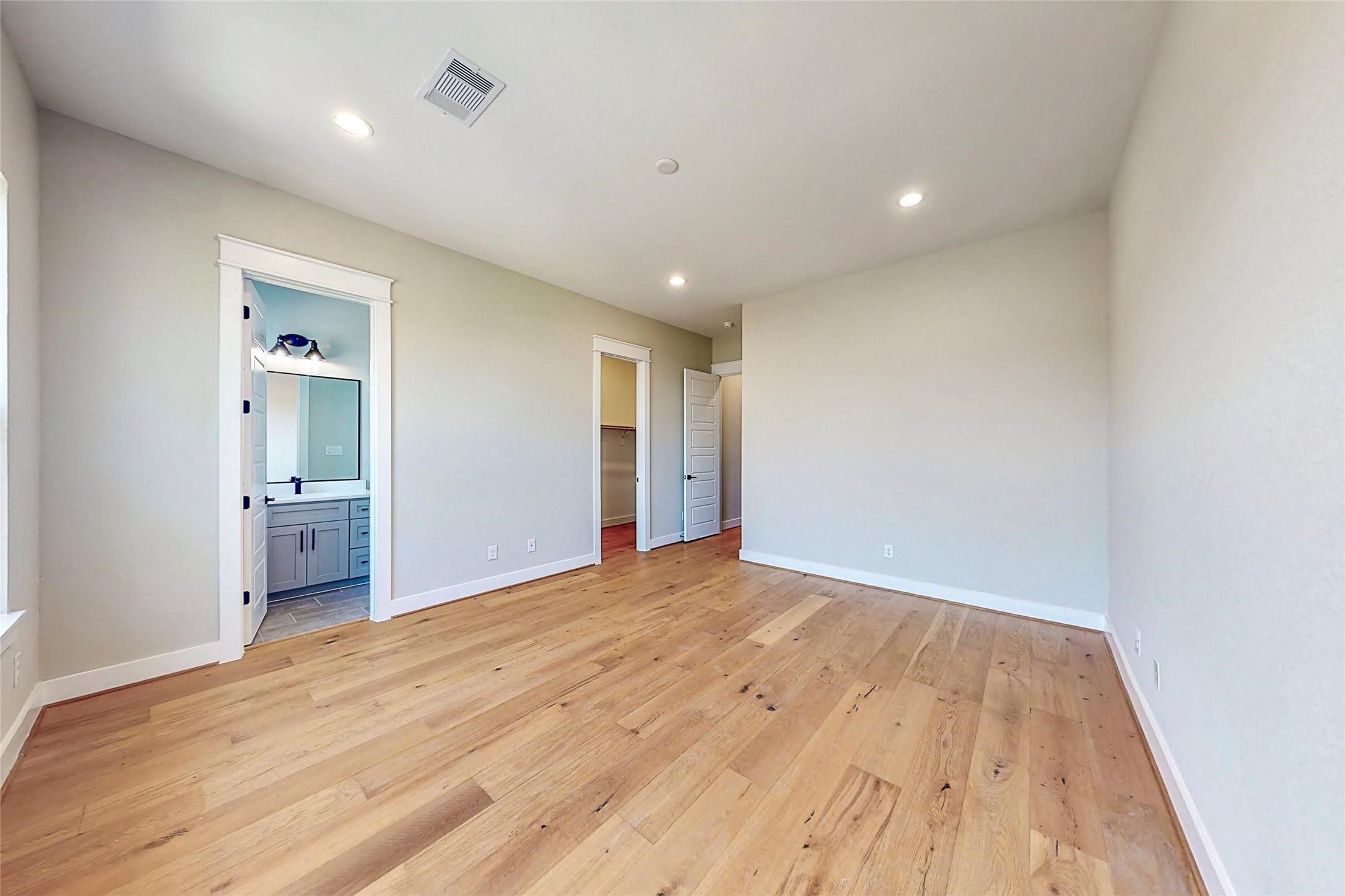 110 East 28th Street Houston, TX 77008 - Photo 26 of 43 an empty room with wooden floor and bathroom