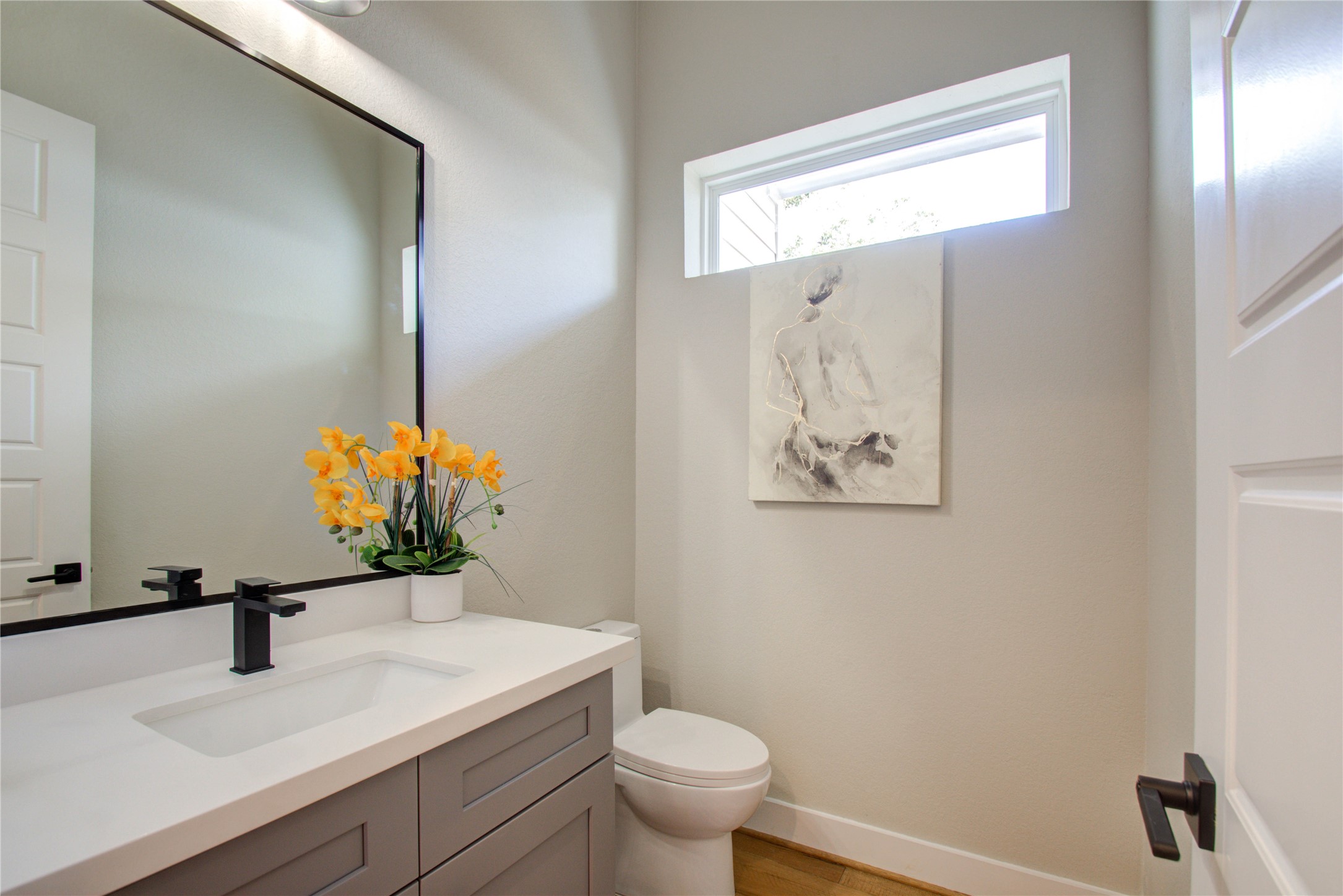 110 East 28th Street Houston, TX 77008 - Photo 27 of 43 a bathroom with a sink a toilet and a mirror
