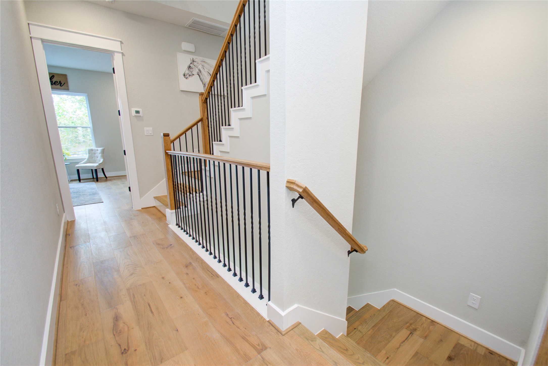 110 East 28th Street Houston, TX 77008 - Photo 28 of 43 a view of a hallway with wooden floor and entryway
