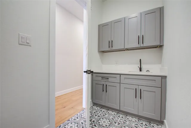 a view of a hallway with wooden floor and entryway