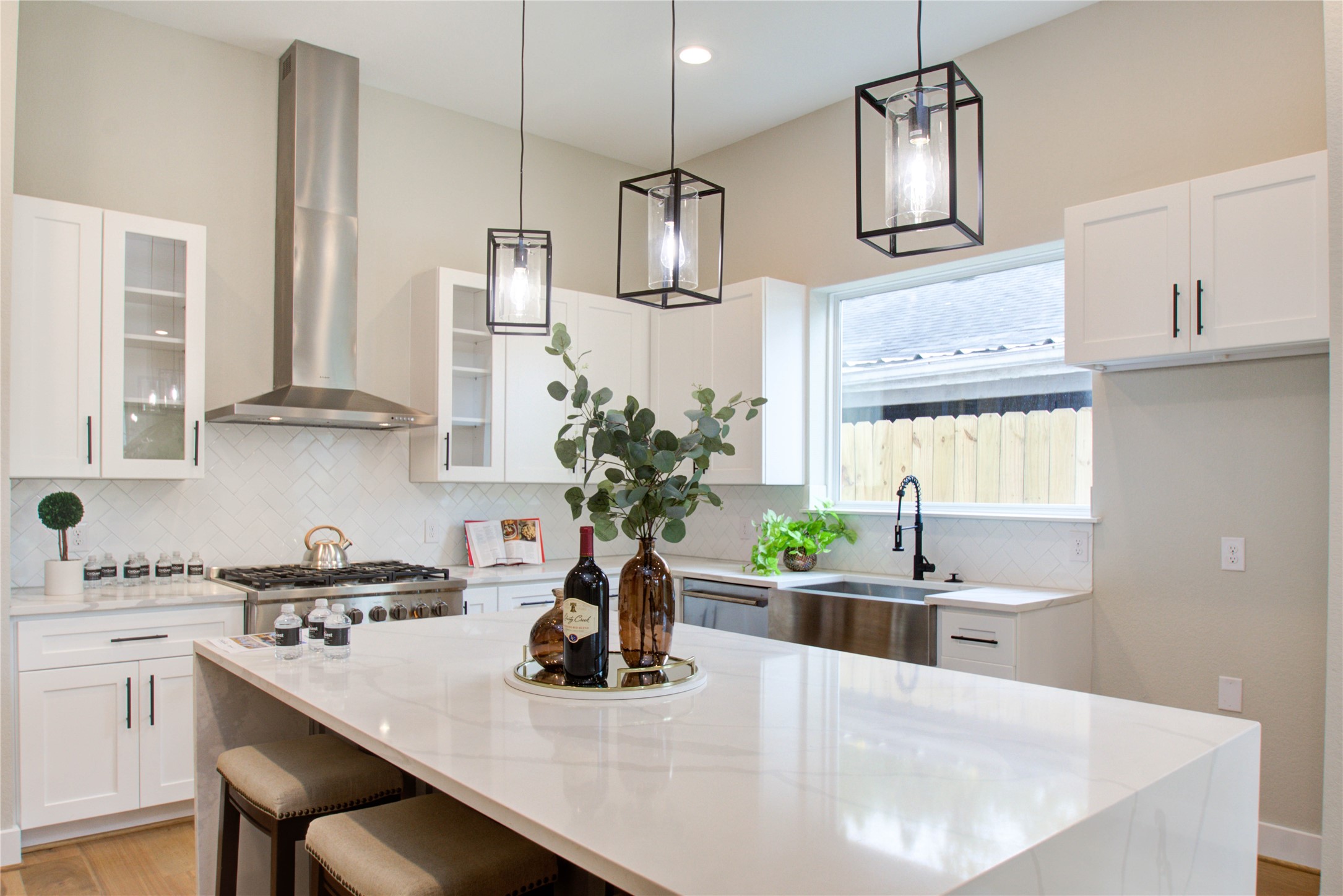 110 East 28th Street Houston, TX 77008 - Photo 30 of 43 a kitchen with a sink a window and chairs