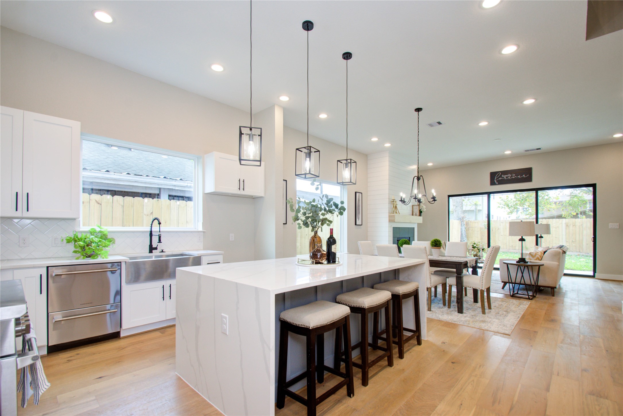 110 East 28th Street Houston, TX 77008 - Photo 4 of 43 a kitchen with stainless steel appliances granite countertop a table chairs stove a sink dishwasher and cabinets