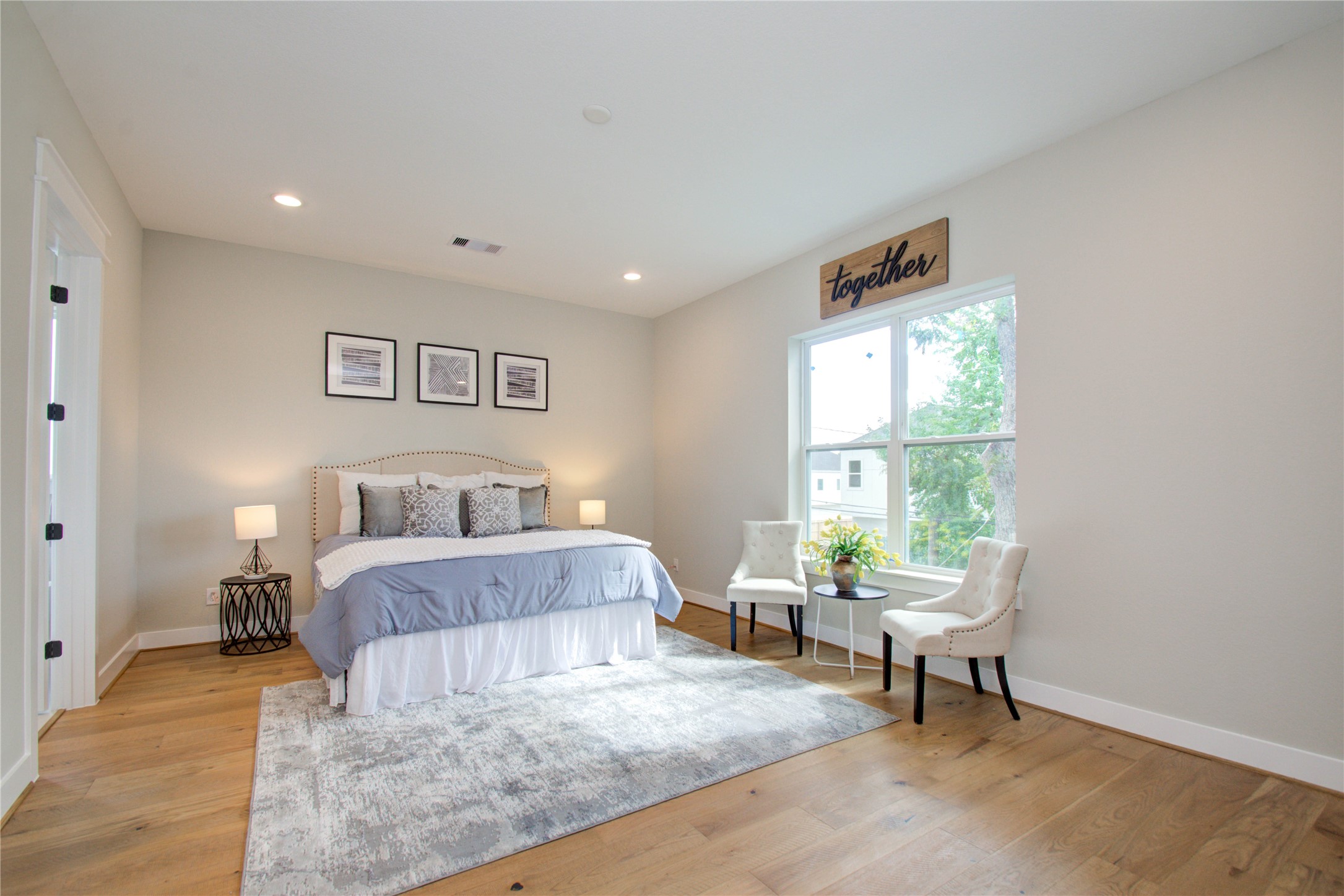 110 East 28th Street Houston, TX 77008 - Photo 7 of 43 a bed room with a bed and a chair