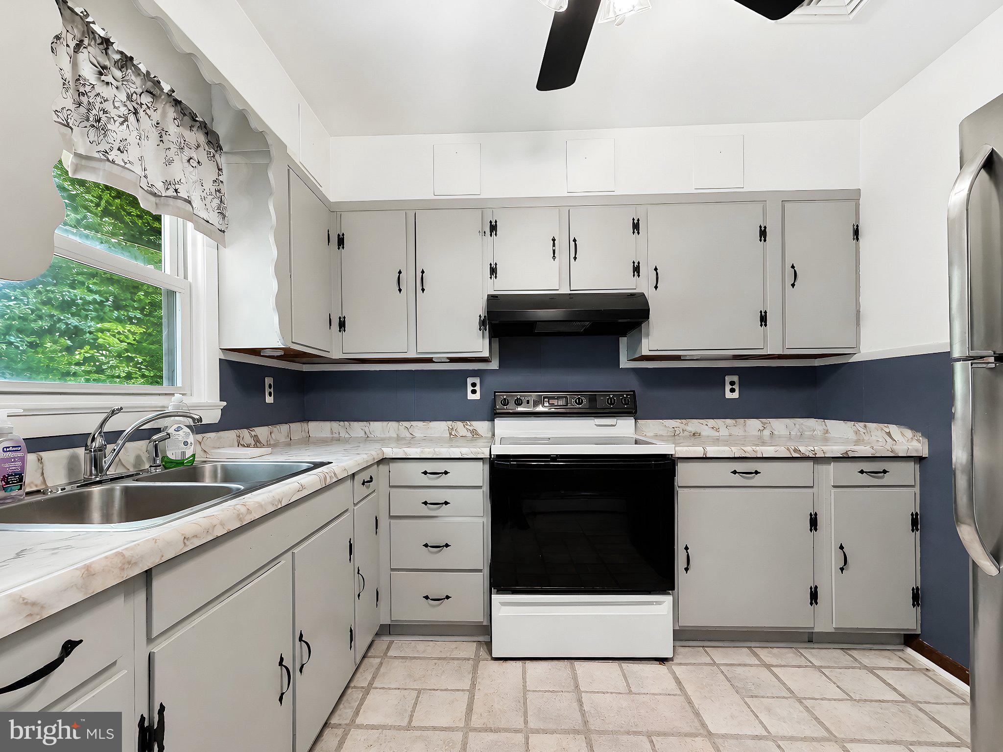 13315 Point Lookout Road Ridge, MD 20680 - Photo 14 of 51 Charming kitchen with modern touches.