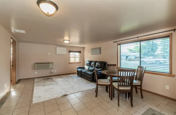 a view of a livingroom with furniture and windows