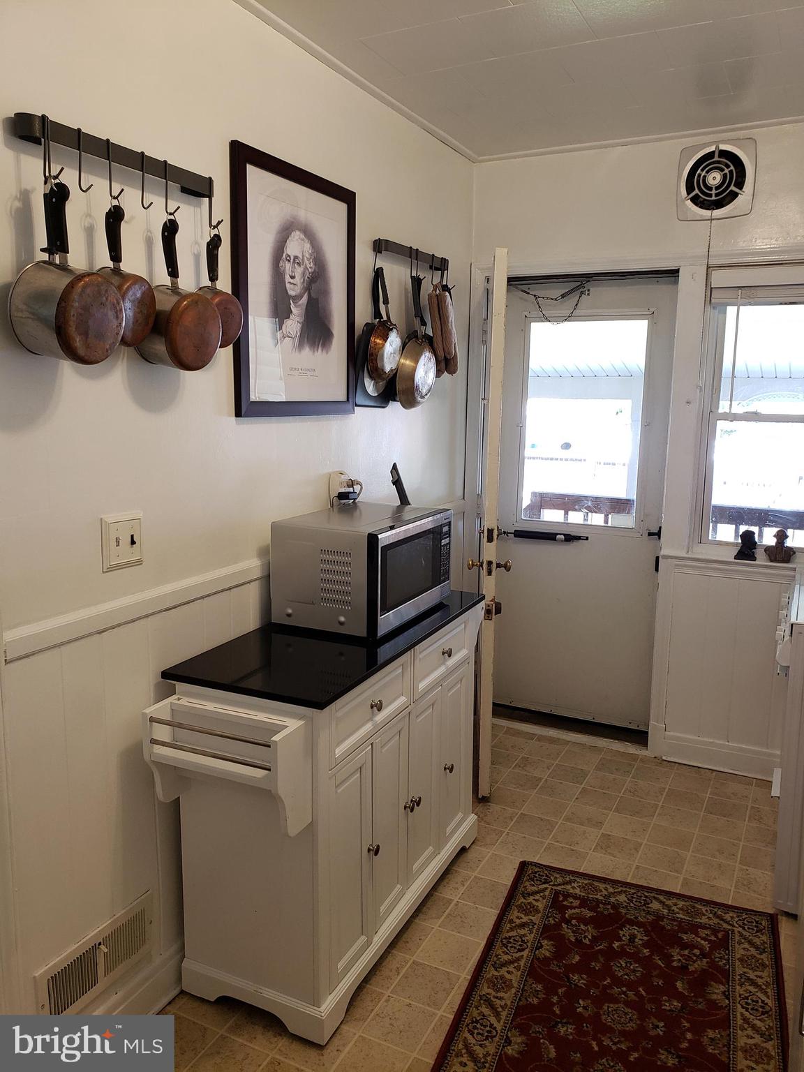 209 Cherrydell Road Baltimore, MD 21228 - Photo 19 of 54 Island provides additional storage. Look at light!