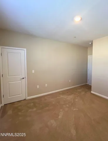 an empty room with a empty space and a window