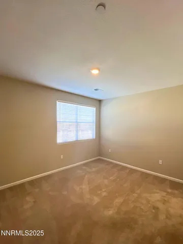 an empty room with a empty space and window