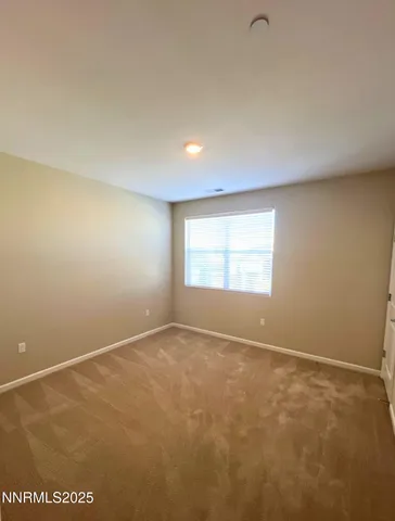 a bathroom with a toilet and a bath tub