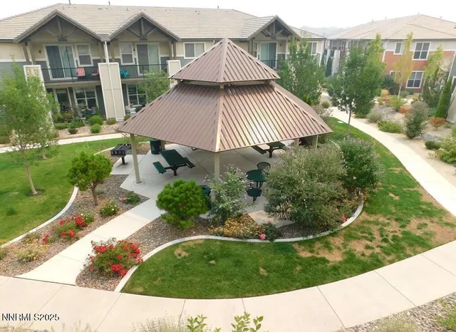 a swimming pool with outdoor seating and yard