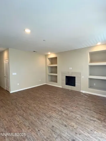 an empty room with a empty space and windows