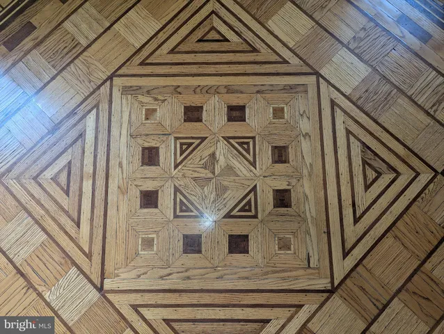 a view of a house with a big yard and large trees