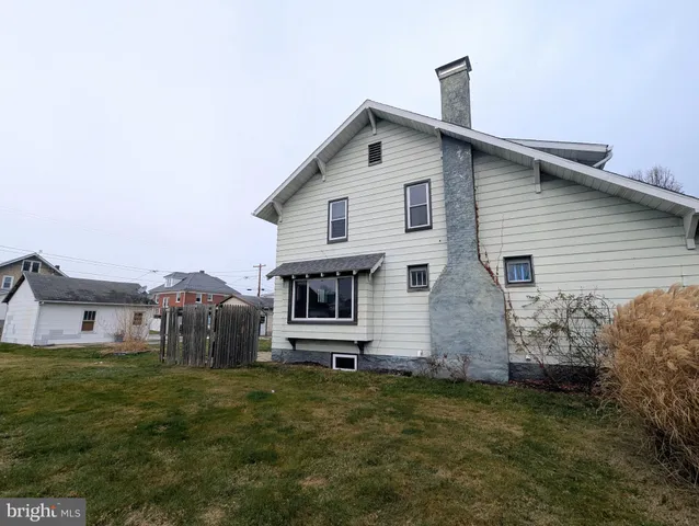 a front view of house with a garden