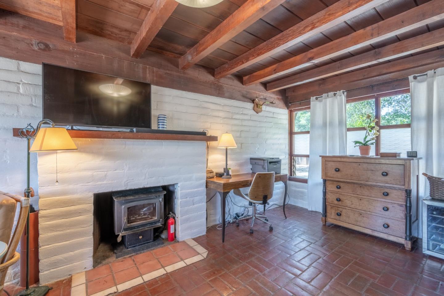72 Los Laureles Grade Road Carmel Valley, CA 93924 - Photo 34 of 43 a living room with furniture and a fireplace