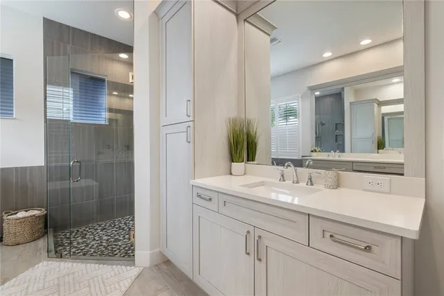 a bathroom with a sink and a mirror