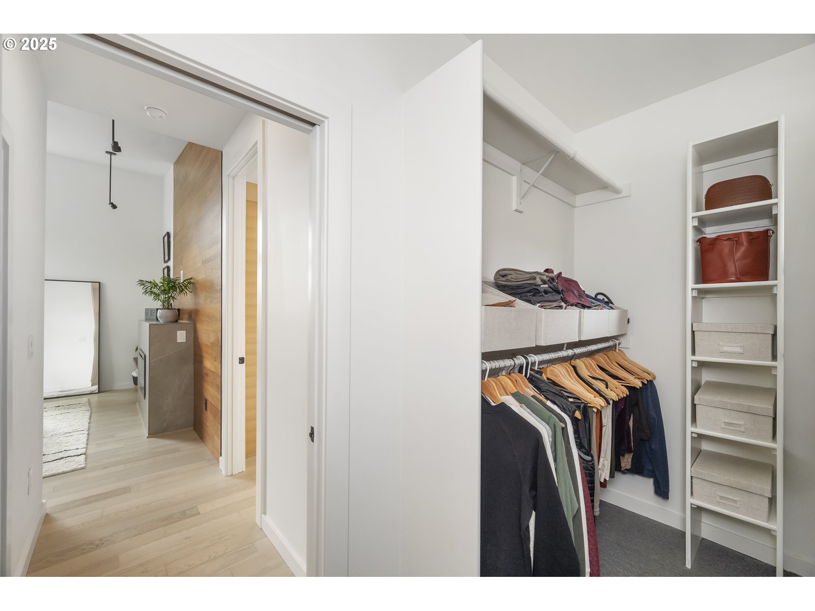 11504 Northwest Damascus Street Portland, OR 97229 - Photo 16 of 48 a view of walk in closet with clothes and shoes