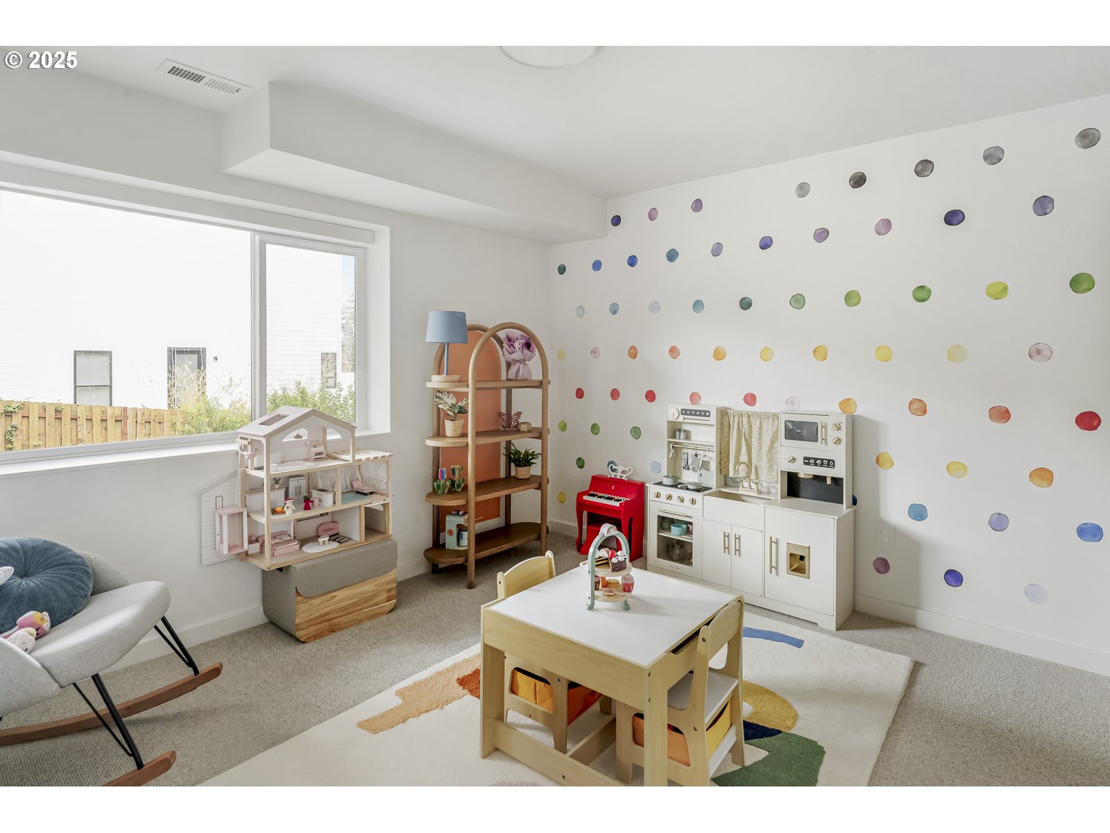 11504 Northwest Damascus Street Portland, OR 97229 - Photo 27 of 48 a living room with furniture a rug and a floor to ceiling window