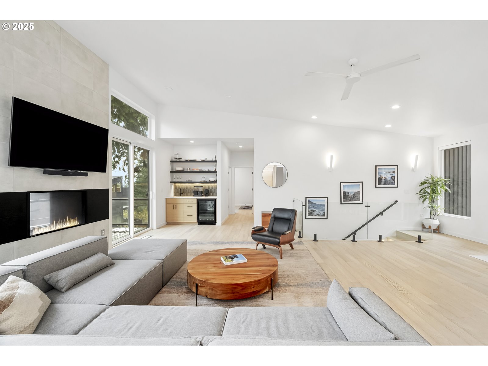 11504 Northwest Damascus Street Portland, OR 97229 - Photo 4 of 48 a living room with furniture and a flat screen tv